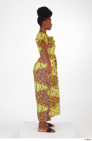  Dina Moses A poses dressed standing whole body yellow long decora apparel african dress 0007.jpg
